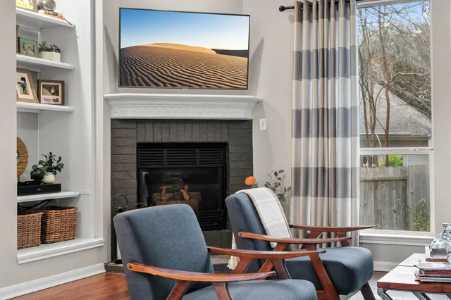 a living room with furniture and a fireplace