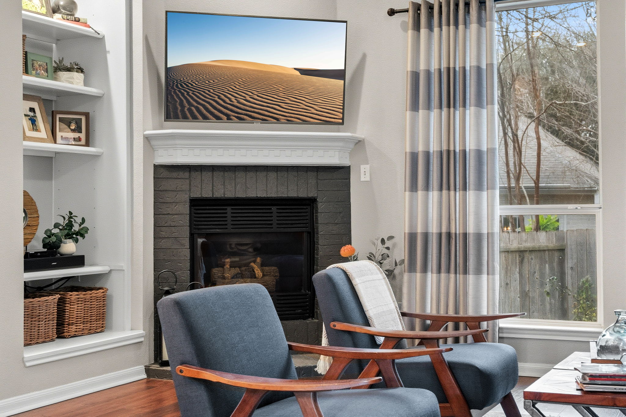 13208 Calf Roping Trail Austin, TX 78727 - Photo 26 of 40 The living room is anchored by a cozy fireplace.