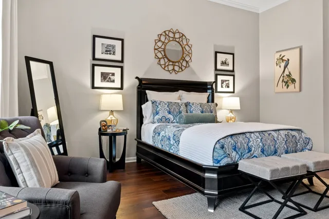 a bedroom with furniture and a window