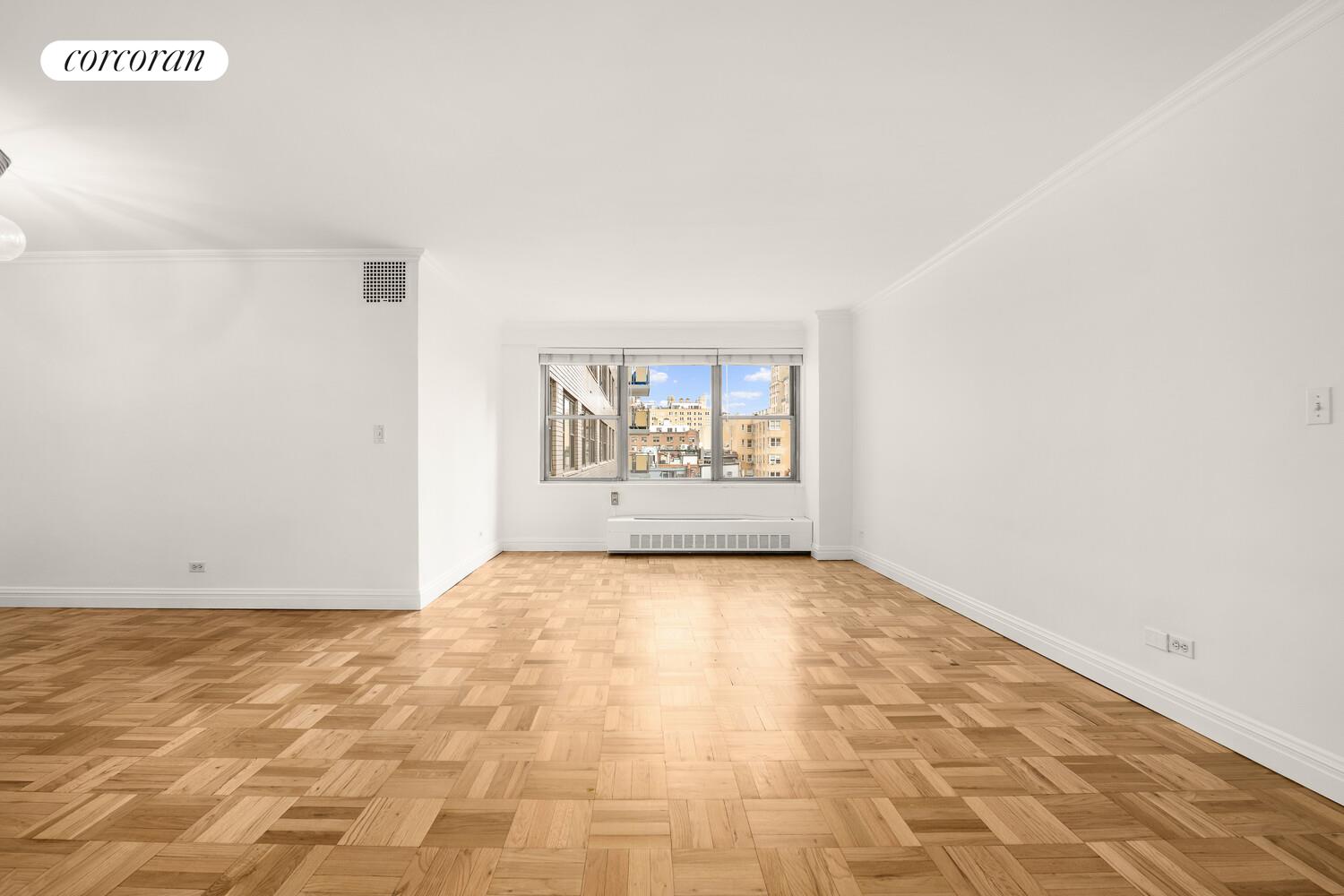 15 West 72nd Street, Unit 9H Manhattan, NY 10023 - Photo 6 of 9 an empty room with windows