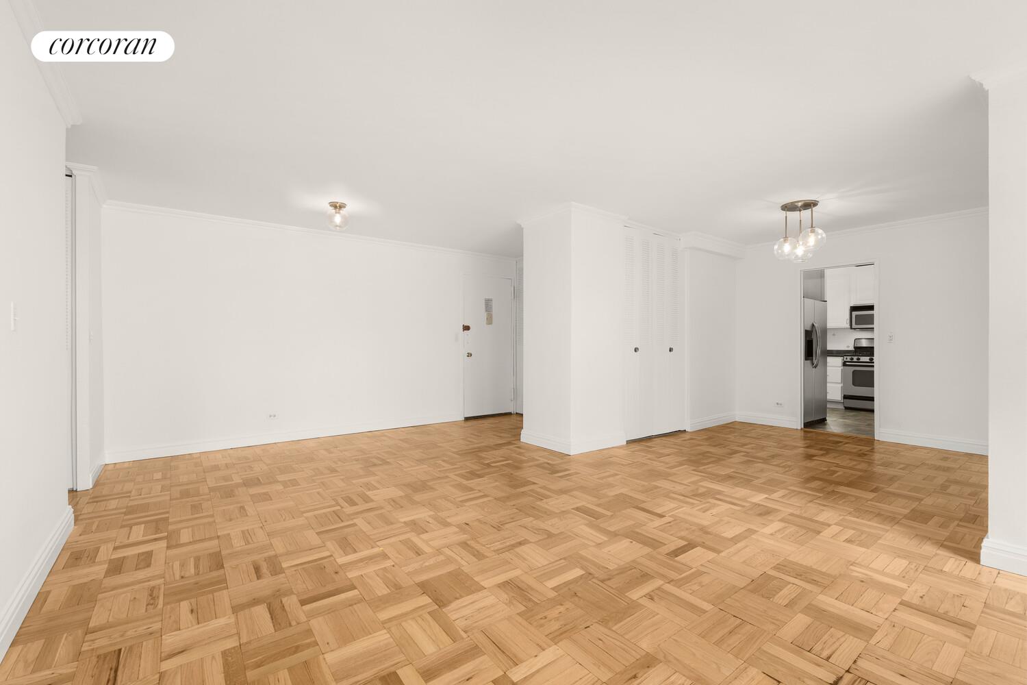 15 West 72nd Street, Unit 9H Manhattan, NY 10023 - Photo 7 of 9 a view of empty room with kitchen view
