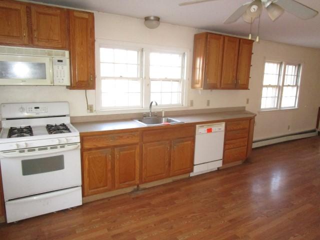 18 Chipman Road Sandwich, MA 02563 - Photo 11 of 16 a kitchen with granite countertop a sink stainless steel appliances and cabinets