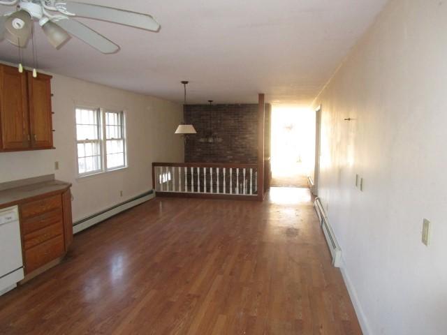18 Chipman Road Sandwich, MA 02563 - Photo 12 of 16 a view of a hallway with wooden floor and staircase