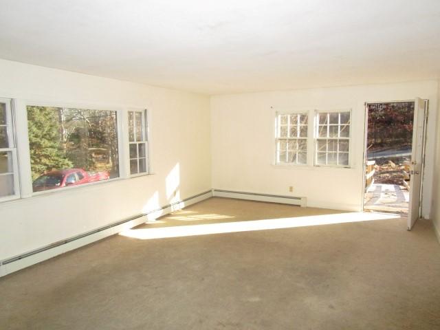 18 Chipman Road Sandwich, MA 02563 - Photo 4 of 16 a view of empty room with wooden floor and fan