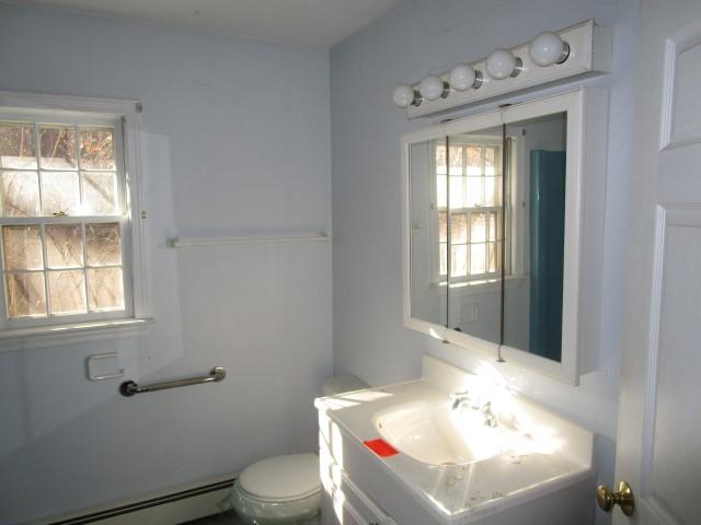 18 Chipman Road Sandwich, MA 02563 - Photo 7 of 16 a bathroom with a sink toilet and window