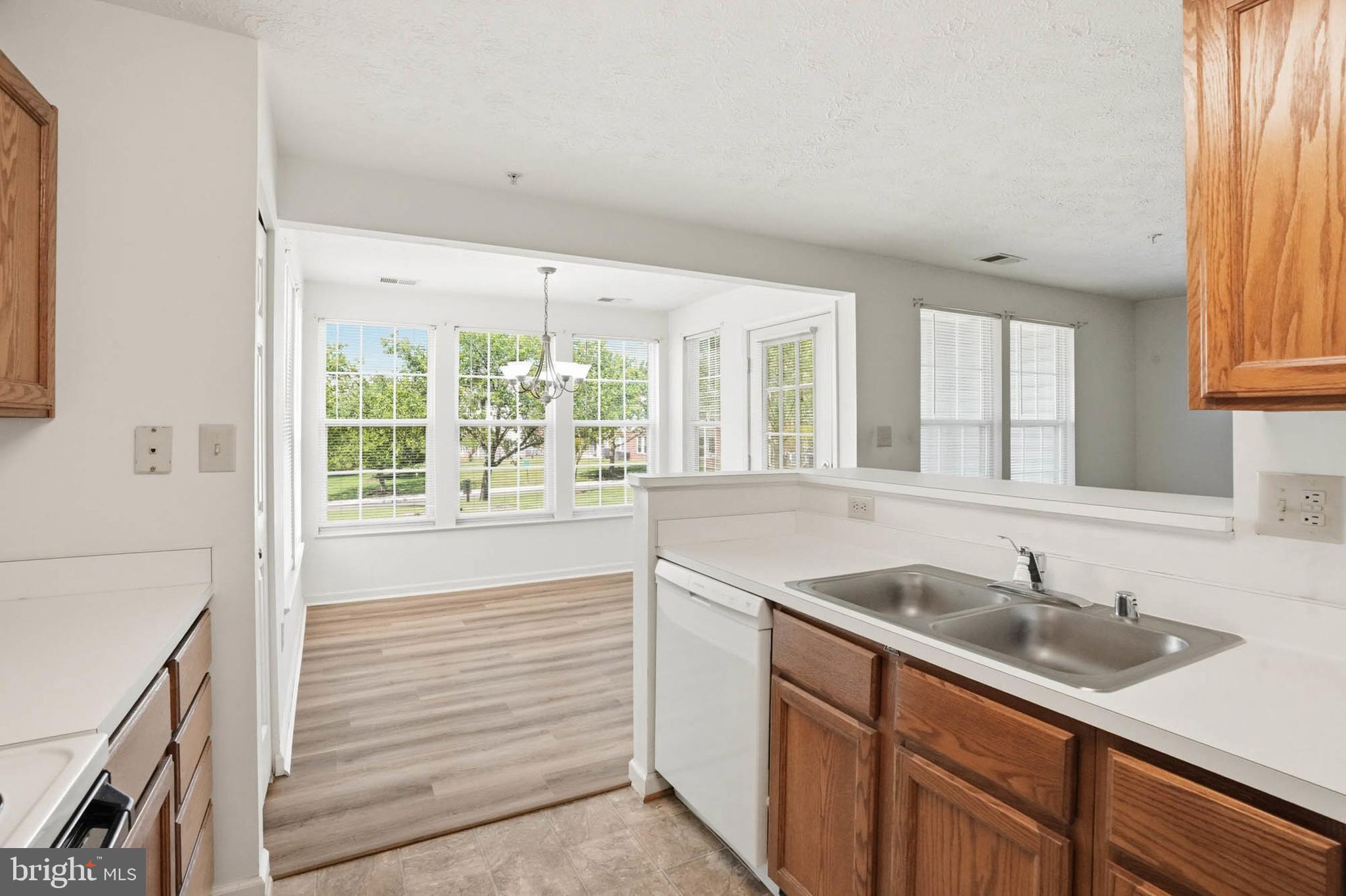 699 Winding Stream Way, Unit 102 Odenton, MD 21113 - Photo 8 of 30 Kitchen opens to Dining