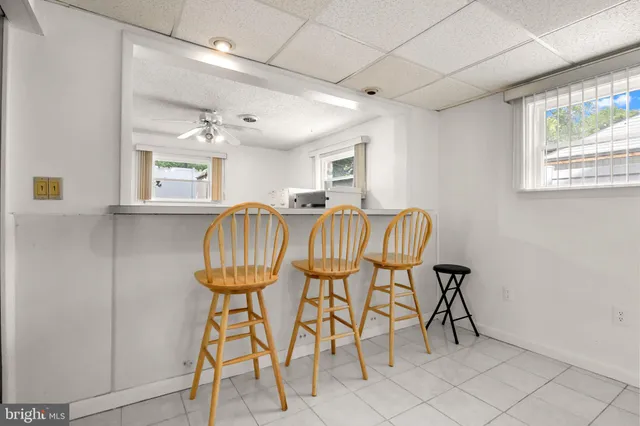 a dining room with furniture and a chandelier