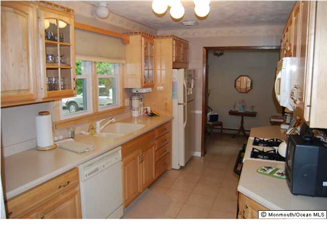 725 Holmdel Road Holmdel, NJ 07733 - Photo 3 of 3 a bathroom with a sink a vanity and a mirror