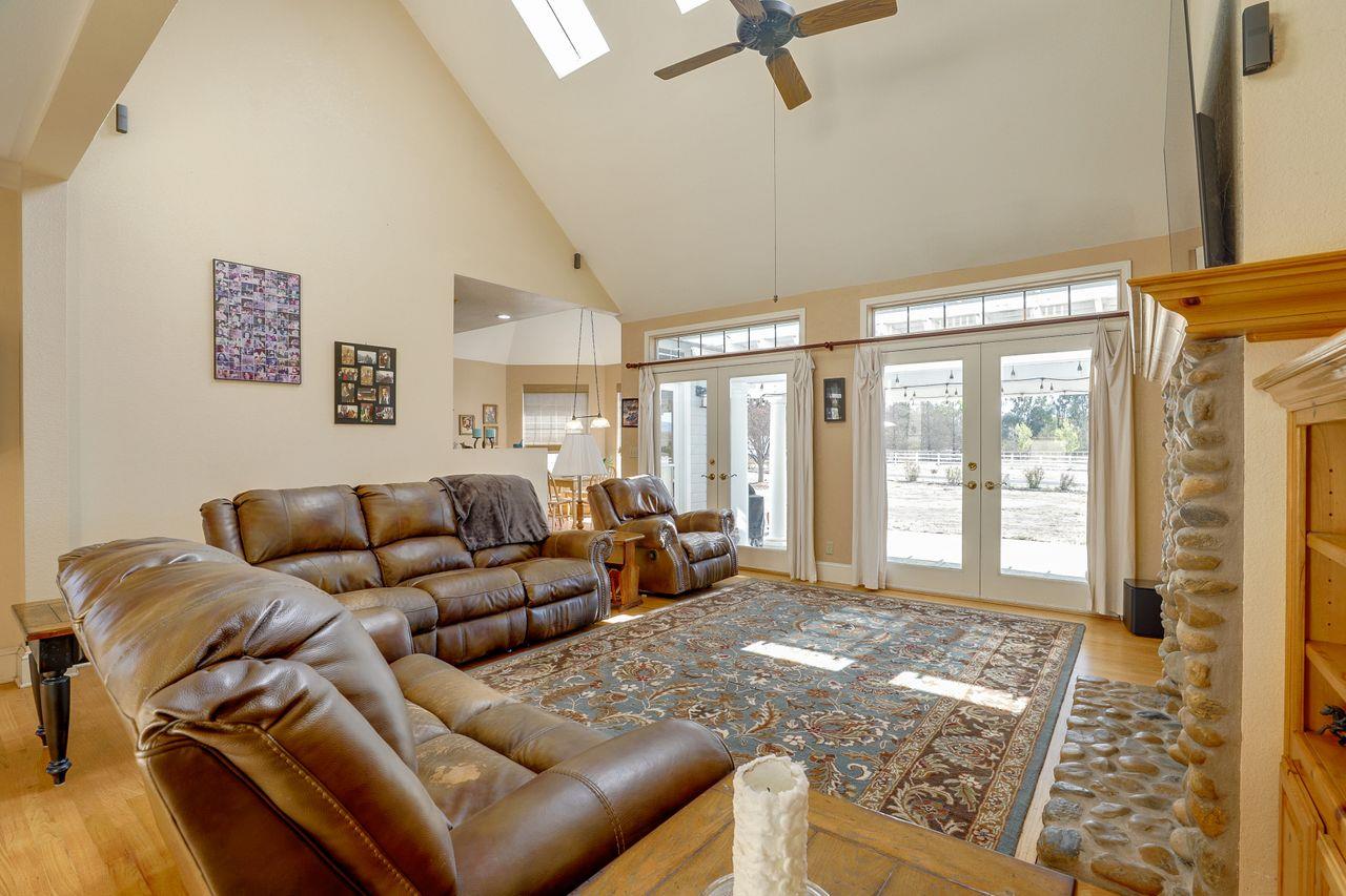 5560 Diablo Hills Road Tres Pinos, CA 95075 - Photo 13 of 46 a living room with furniture and a floor to ceiling window