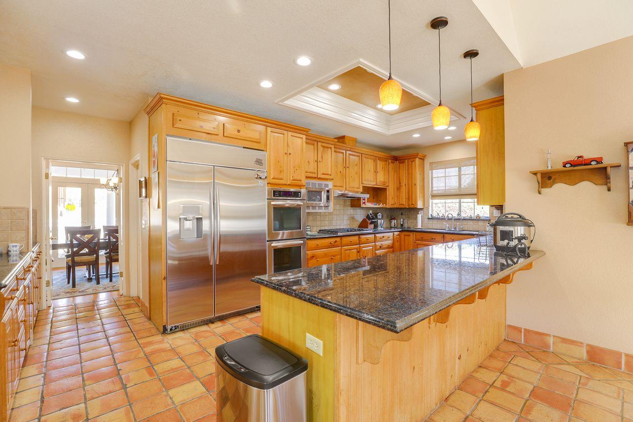 5560 Diablo Hills Road Tres Pinos, CA 95075 - Photo 14 of 46 a kitchen with stainless steel appliances granite countertop a sink and a refrigerator