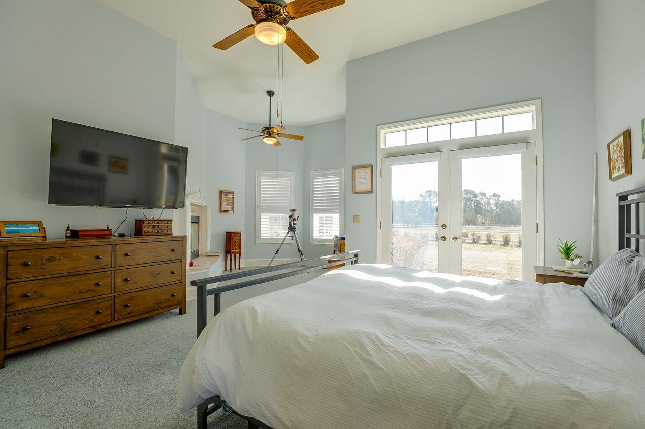 5560 Diablo Hills Road Tres Pinos, CA 95075 - Photo 24 of 46 a bedroom with a bed and flat screen tv
