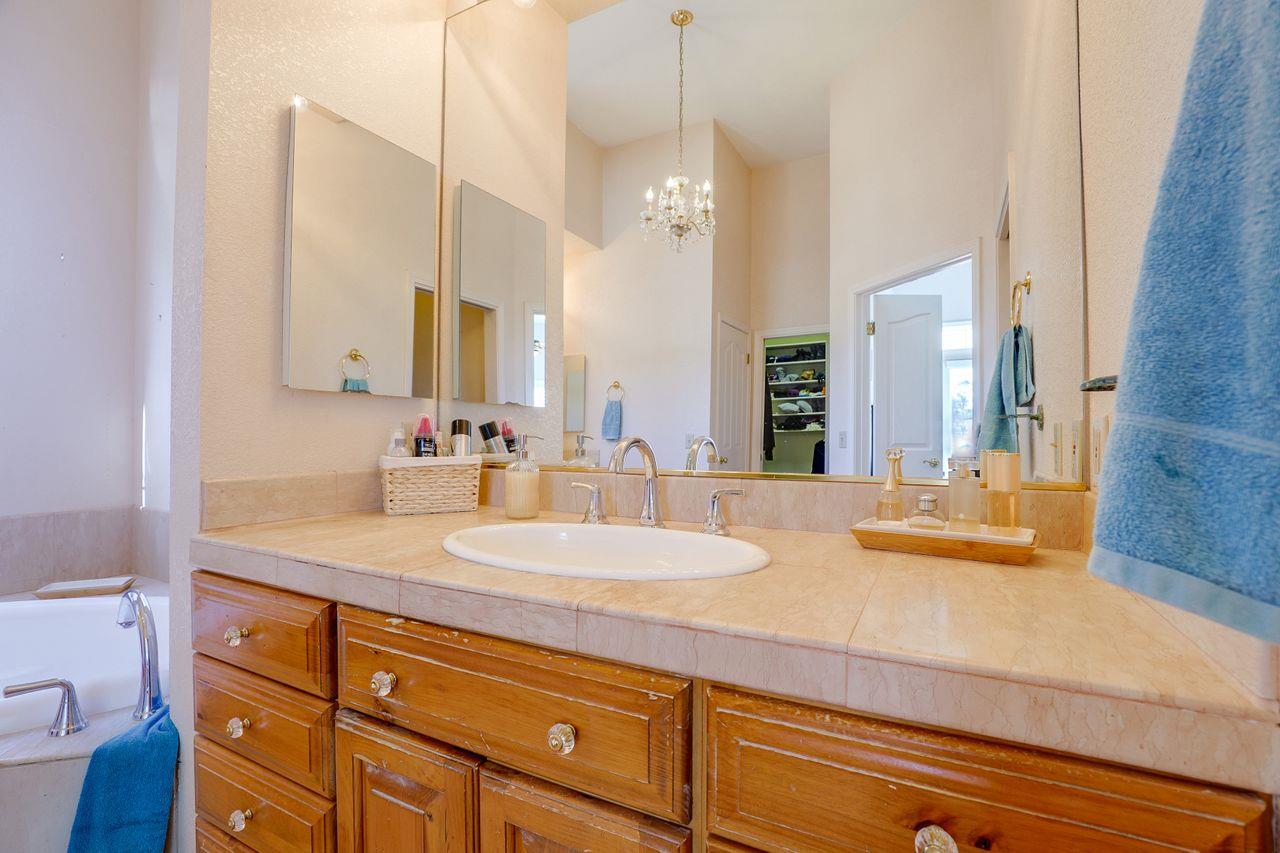 5560 Diablo Hills Road Tres Pinos, CA 95075 - Photo 26 of 46 a bathroom with a granite countertop sink and a mirror