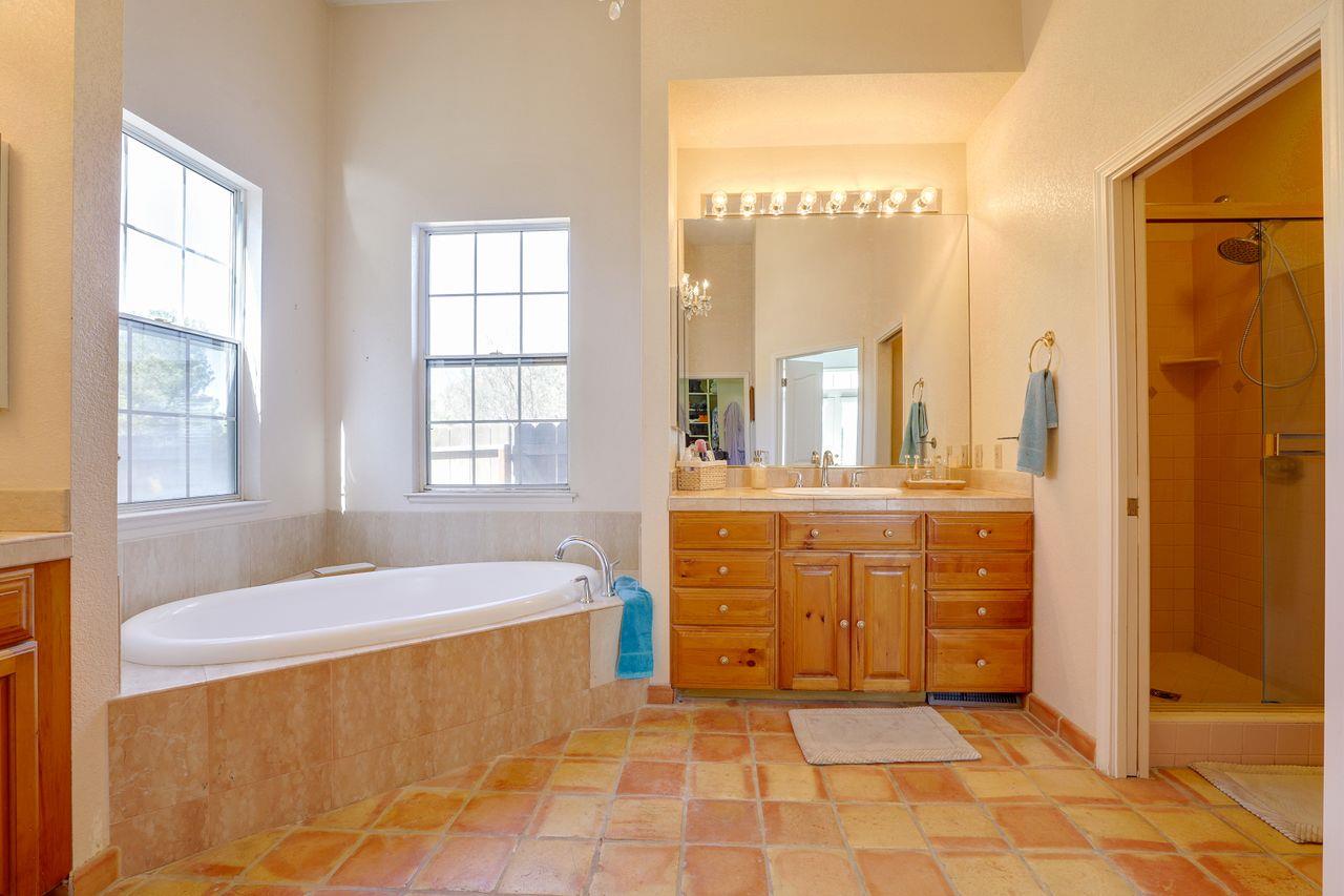 5560 Diablo Hills Road Tres Pinos, CA 95075 - Photo 27 of 46 a bathroom with a tub sink and mirror