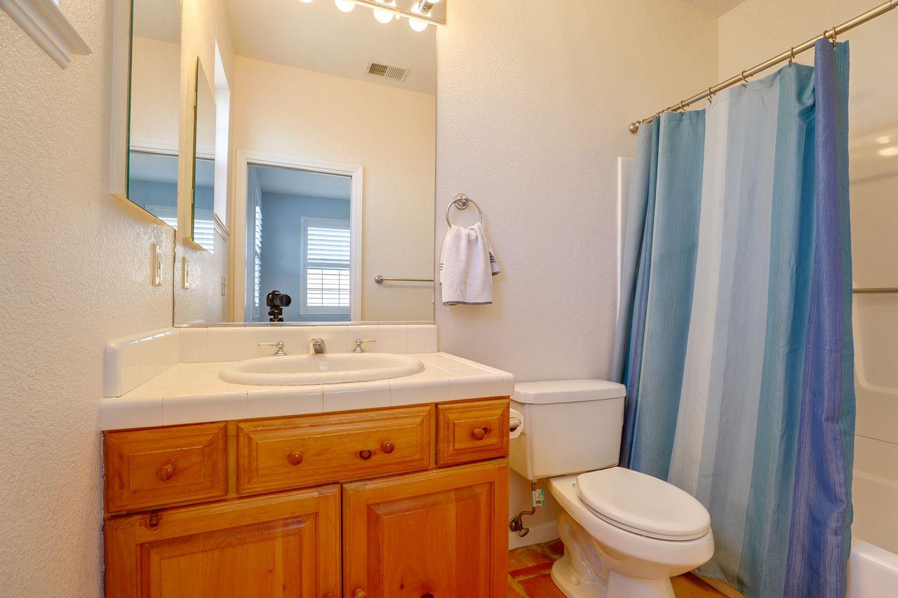 5560 Diablo Hills Road Tres Pinos, CA 95075 - Photo 37 of 46 a bathroom with a sink a toilet a mirror and shower