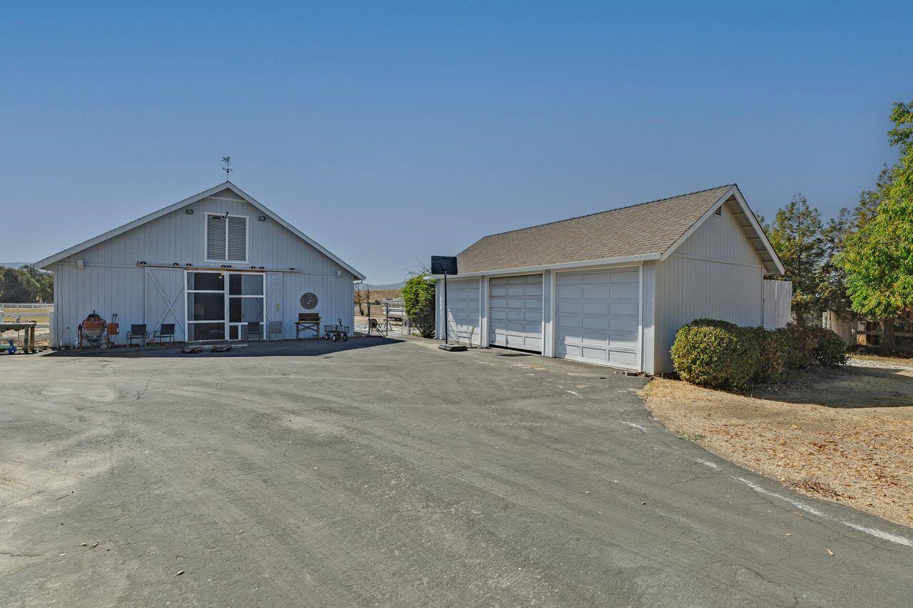 5560 Diablo Hills Road Tres Pinos, CA 95075 - Photo 41 of 46 a front view of a house with a yard and garage
