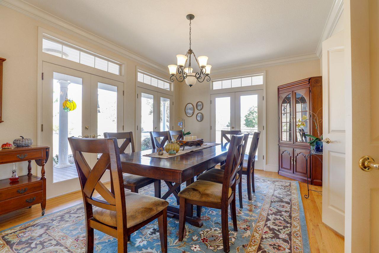 5560 Diablo Hills Road Tres Pinos, CA 95075 - Photo 8 of 46 a view of a dining room with furniture and chandelier
