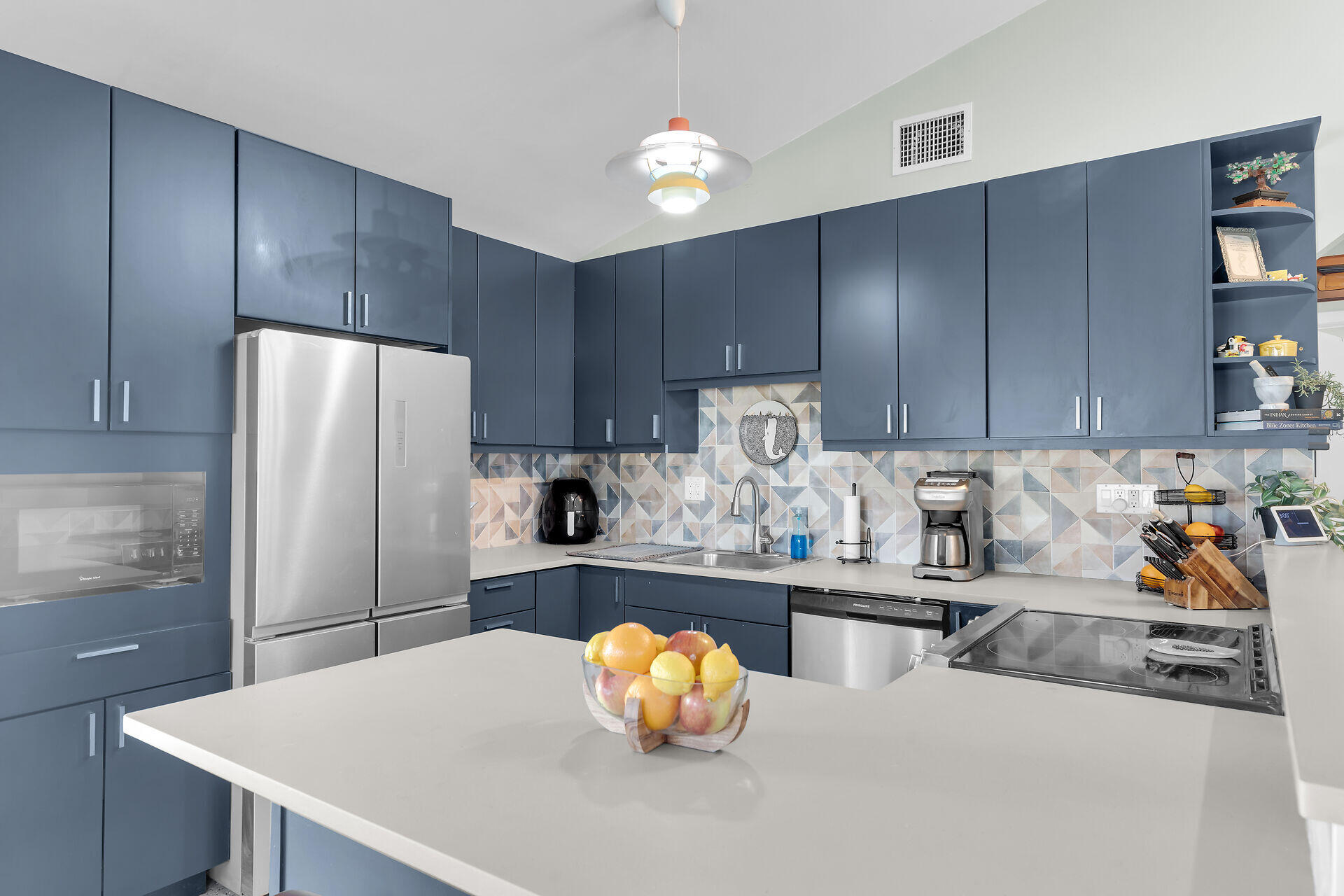 1417 8th Street Key West, FL 33040 - Photo 12 of 44 a kitchen with granite countertop a refrigerator a stove a sink and dishwasher