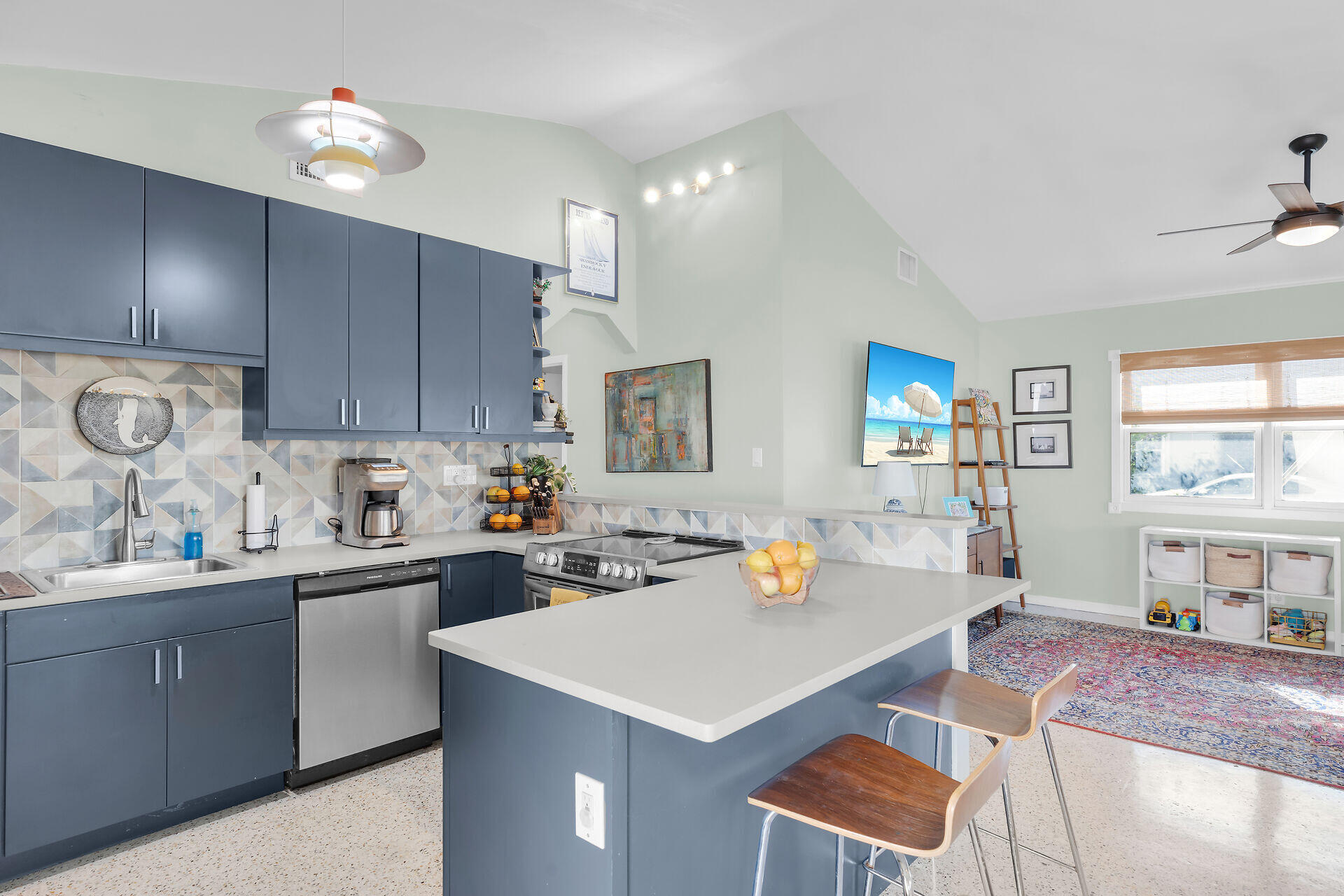1417 8th Street Key West, FL 33040 - Photo 13 of 44 a kitchen with a sink a stove and cabinets