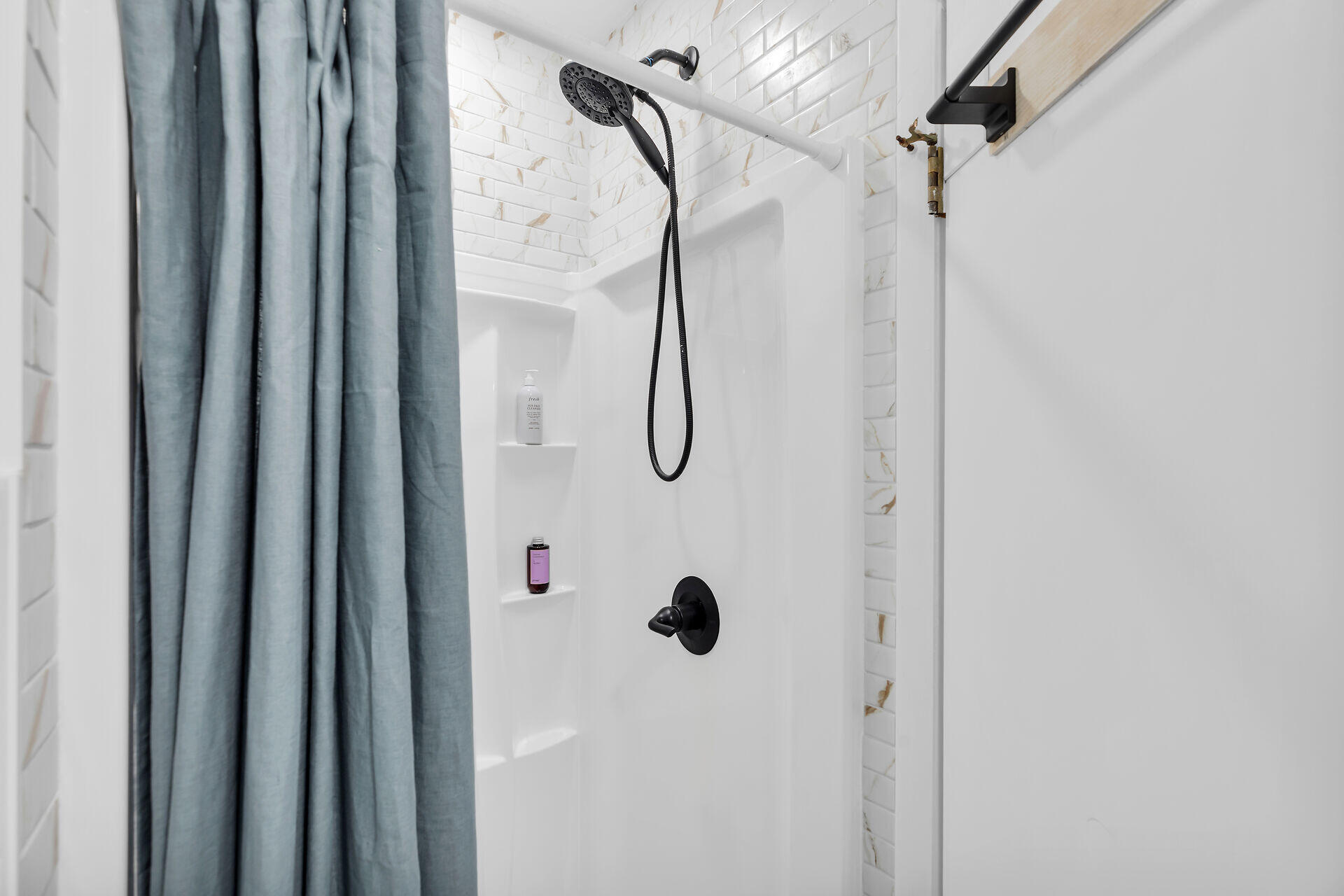 1417 8th Street Key West, FL 33040 - Photo 16 of 44 a bathroom with a glass shower door