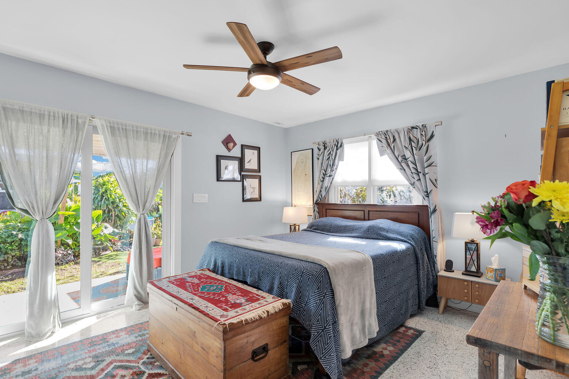 1417 8th Street Key West, FL 33040 - Photo 17 of 44 a bedroom with a bed a chandelier and a window