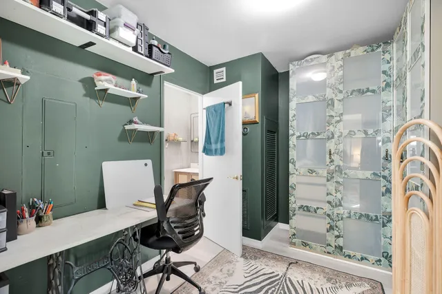 a workspace with furniture and a chandelier