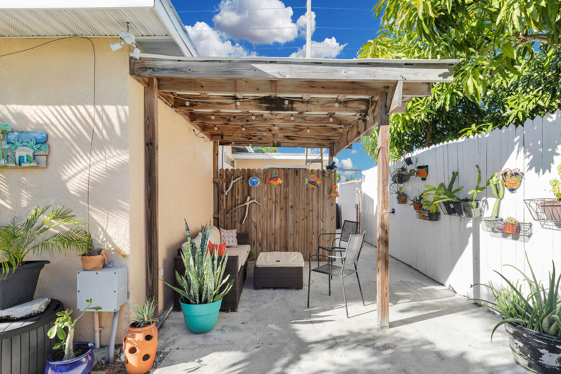 1417 8th Street Key West, FL 33040 - Photo 28 of 44 a patio with table and chairs potted plants