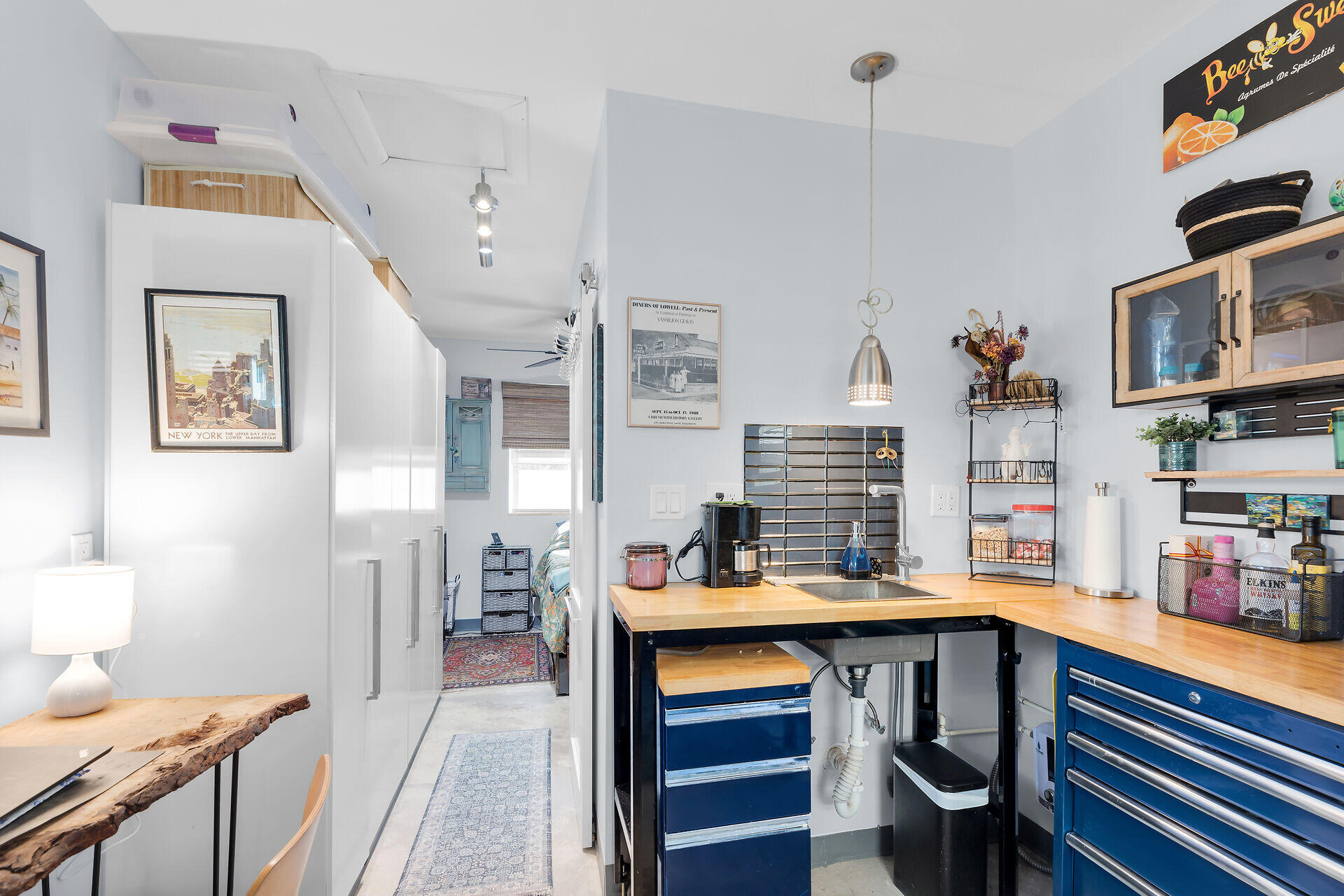 1417 8th Street Key West, FL 33040 - Photo 36 of 44 a room with a wooden floor and furniture