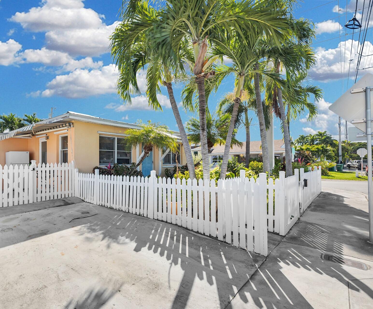 1417 8th Street Key West, FL 33040 - Photo 4 of 44 a view of a yard with plants and wooden fence