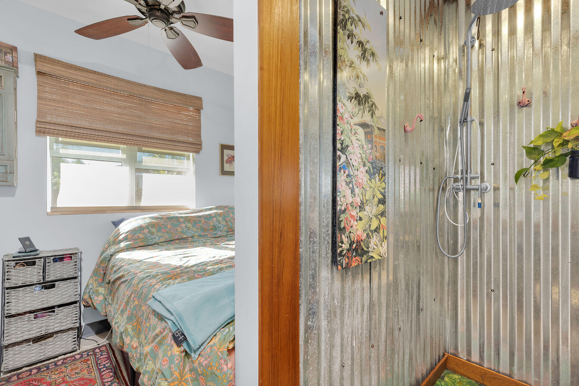 1417 8th Street Key West, FL 33040 - Photo 41 of 44 a bedroom with a bed and a chandelier