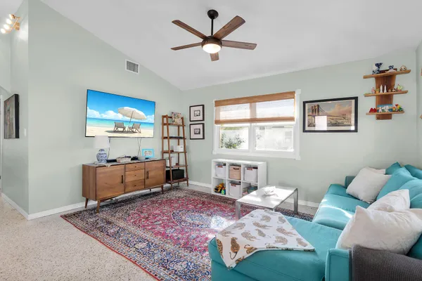 a living room with furniture and a window