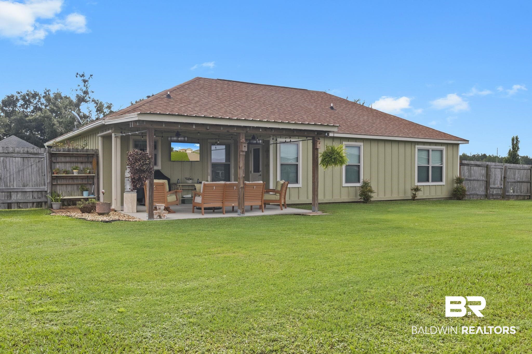 203 Lakefront Circle Summerdale, AL 36580 - Photo 61 of 69 Back of house with a lawn and a patio