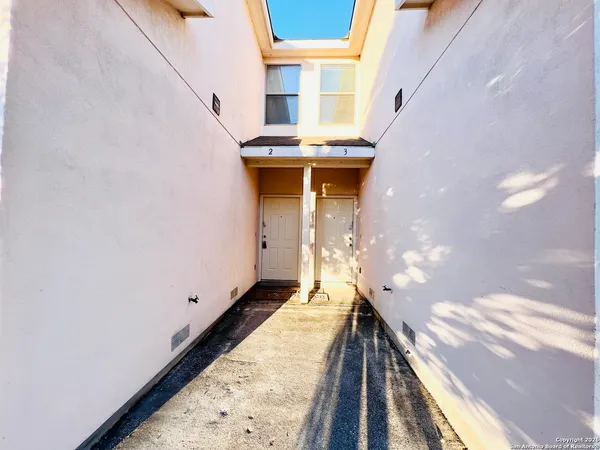 a view of balcony with furniture