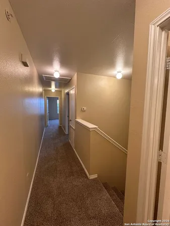 a view of hallway with stairs