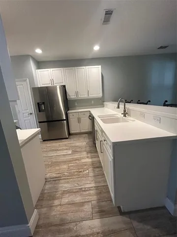 a bathroom with a sink a mirror and a toilet