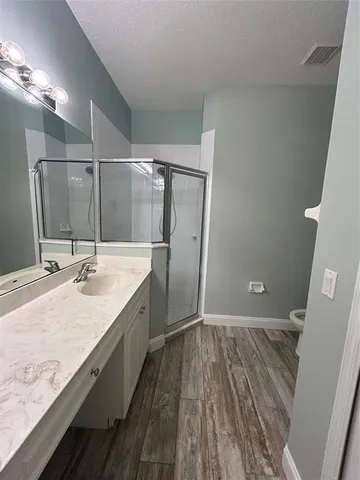 a bathroom with a sink and mirror