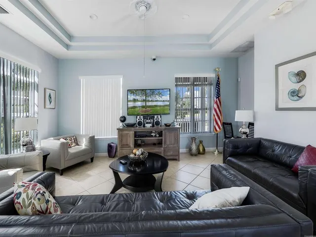 a living room with furniture or couch and a flat screen tv