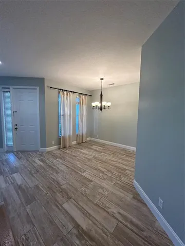 a view of a livingroom with wooden floor