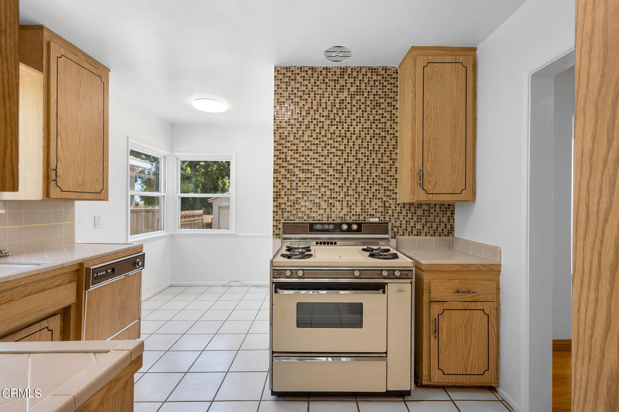 50 Marathon Road Altadena, CA 91001 - Photo 12 of 33 a kitchen with stainless steel appliances a stove a sink and a microwave