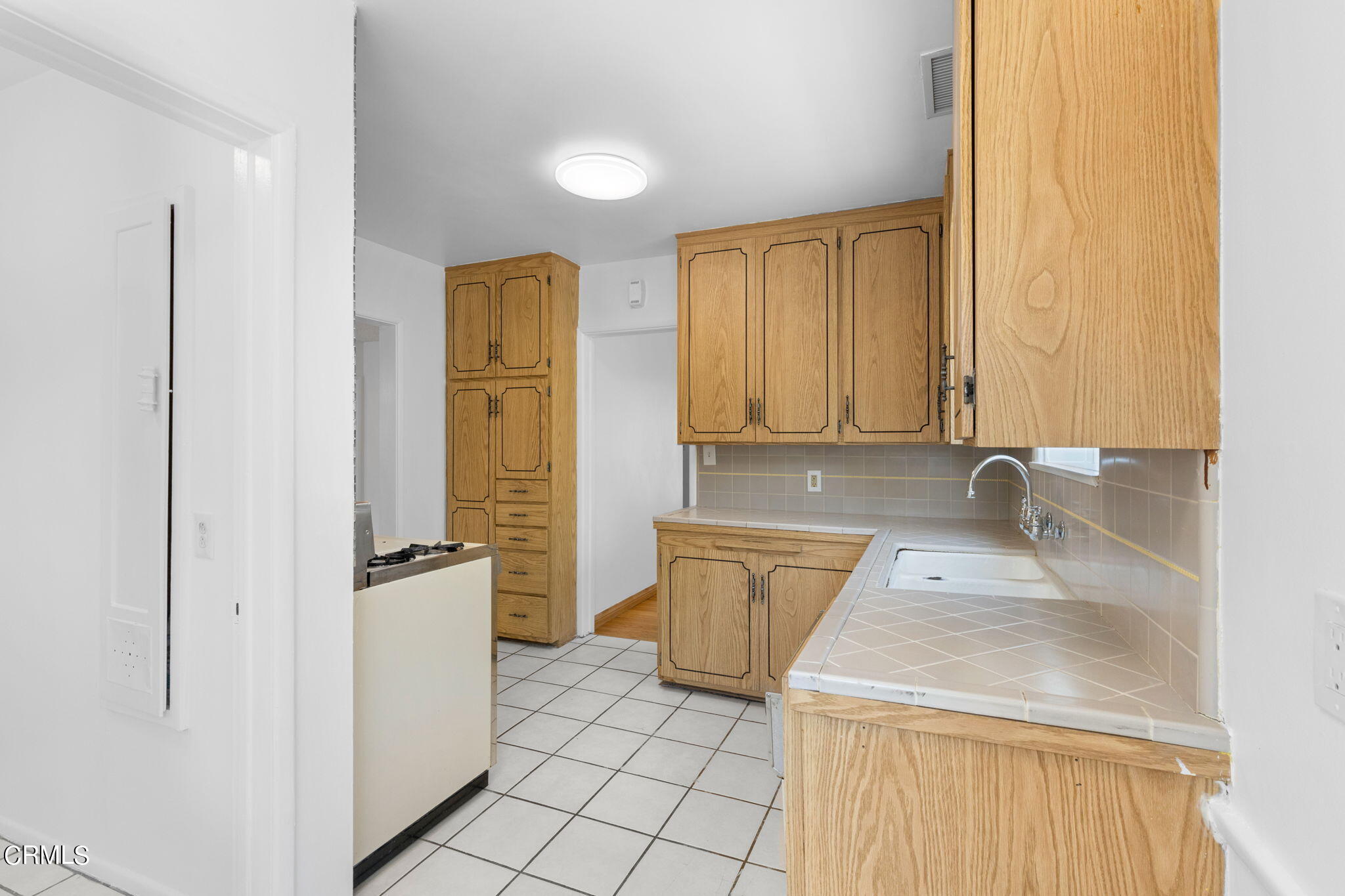 50 Marathon Road Altadena, CA 91001 - Photo 13 of 33 a bathroom with a granite countertop sink and a mirror