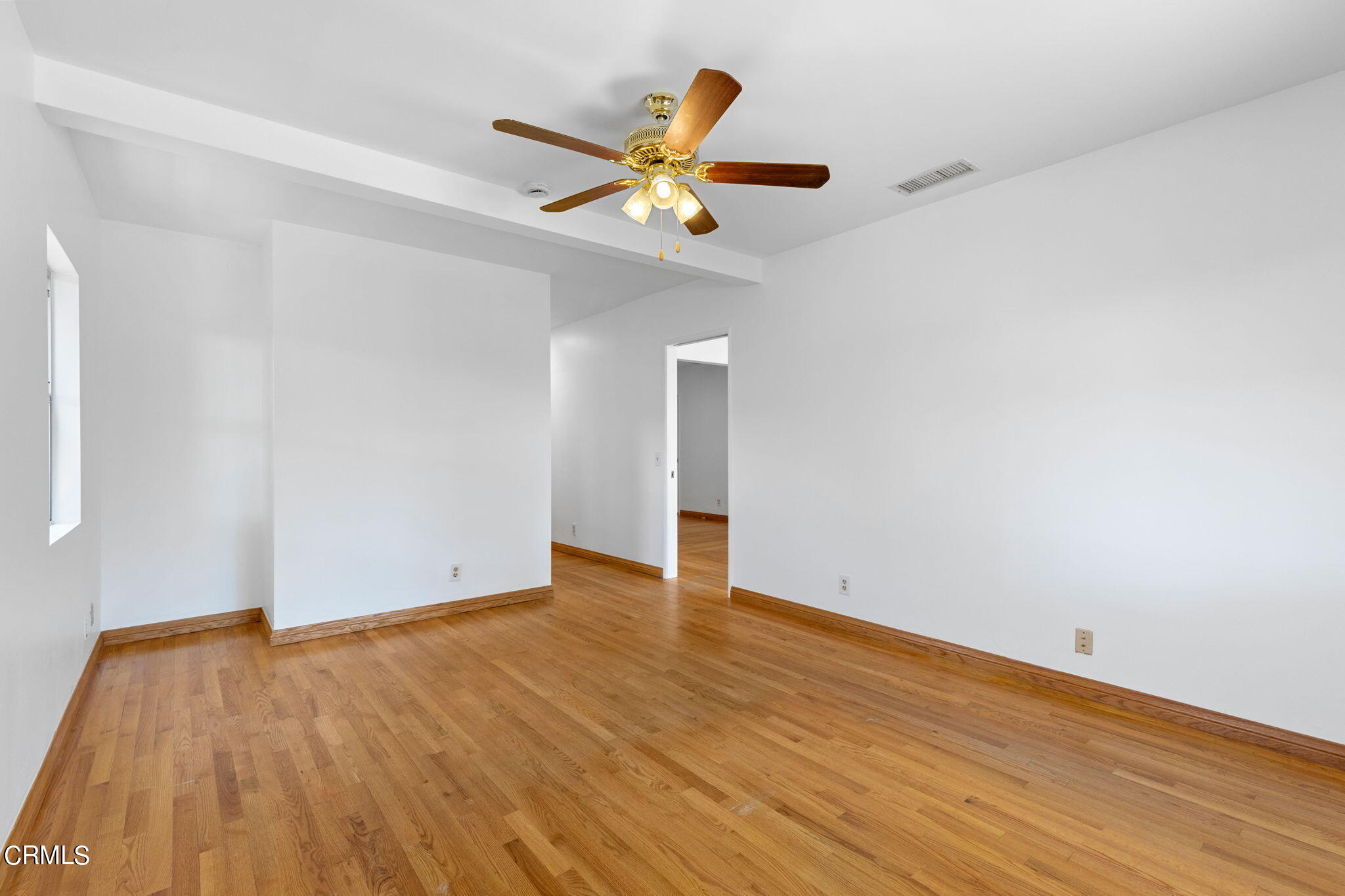 50 Marathon Road Altadena, CA 91001 - Photo 15 of 33 an empty room with wooden floor and ceiling fan