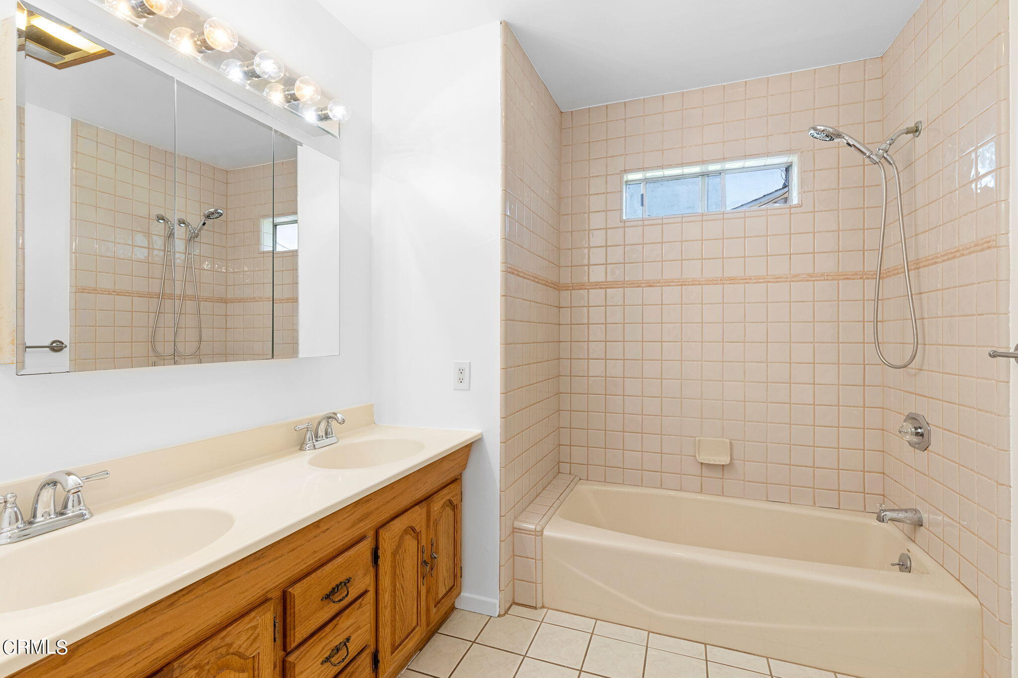 50 Marathon Road Altadena, CA 91001 - Photo 23 of 33 a bathroom with a granite countertop sink a mirror a bathtub and shower