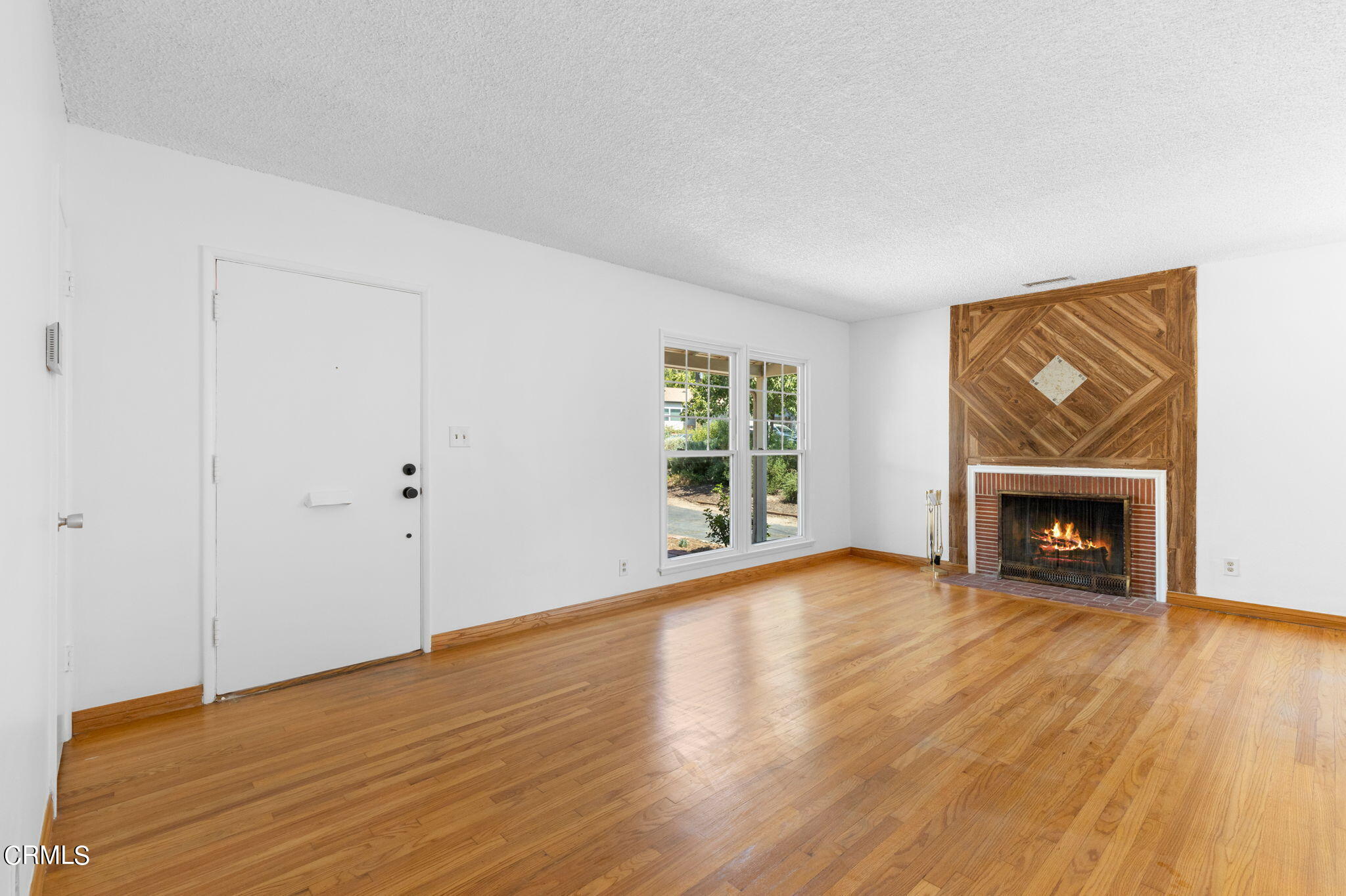 50 Marathon Road Altadena, CA 91001 - Photo 4 of 33 a view of an empty room with wooden floor and a window