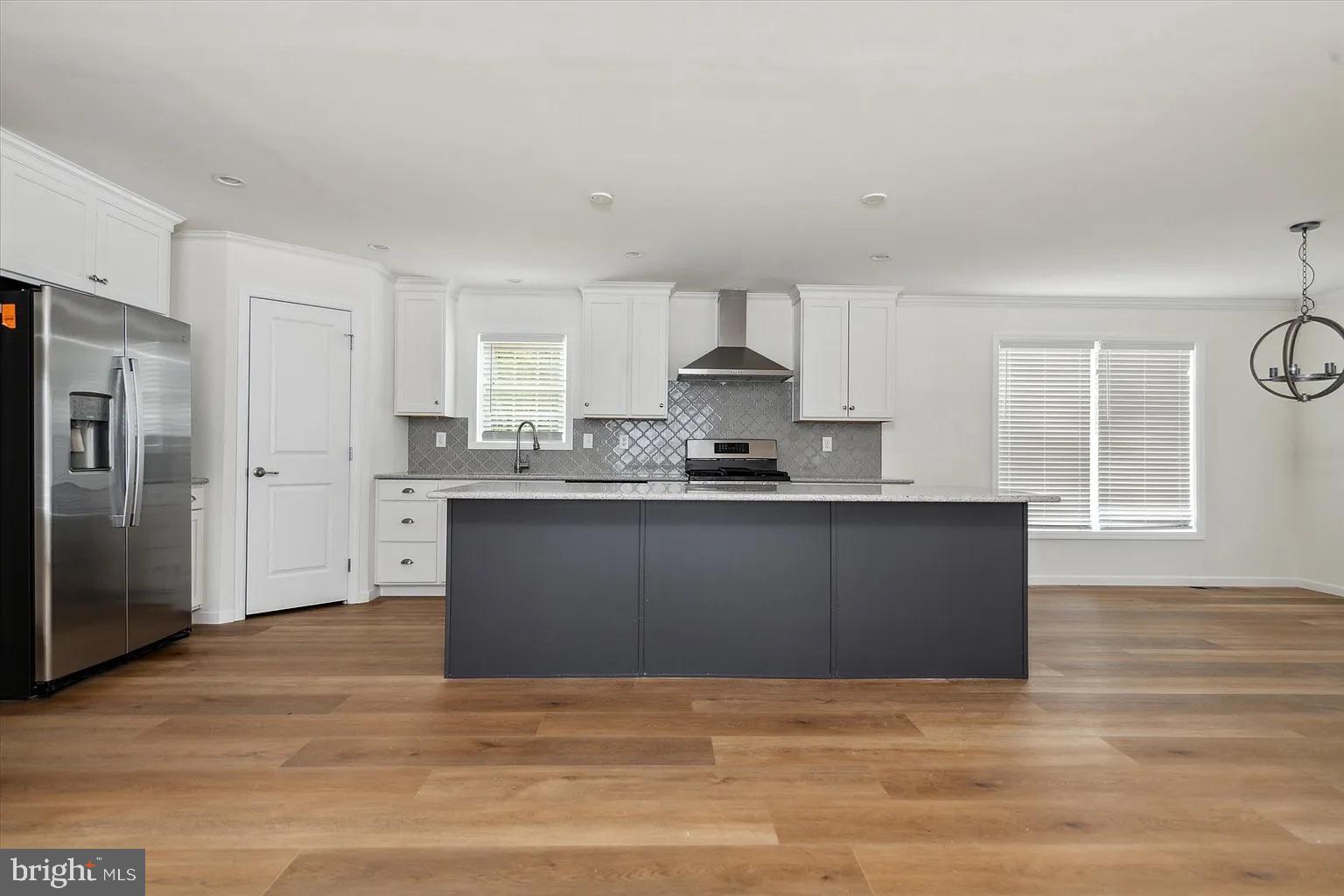 2 Ginger Lane Conowingo, MD 21918 - Photo 13 of 27 a kitchen with granite countertop a refrigerator cabinets and wooden floor