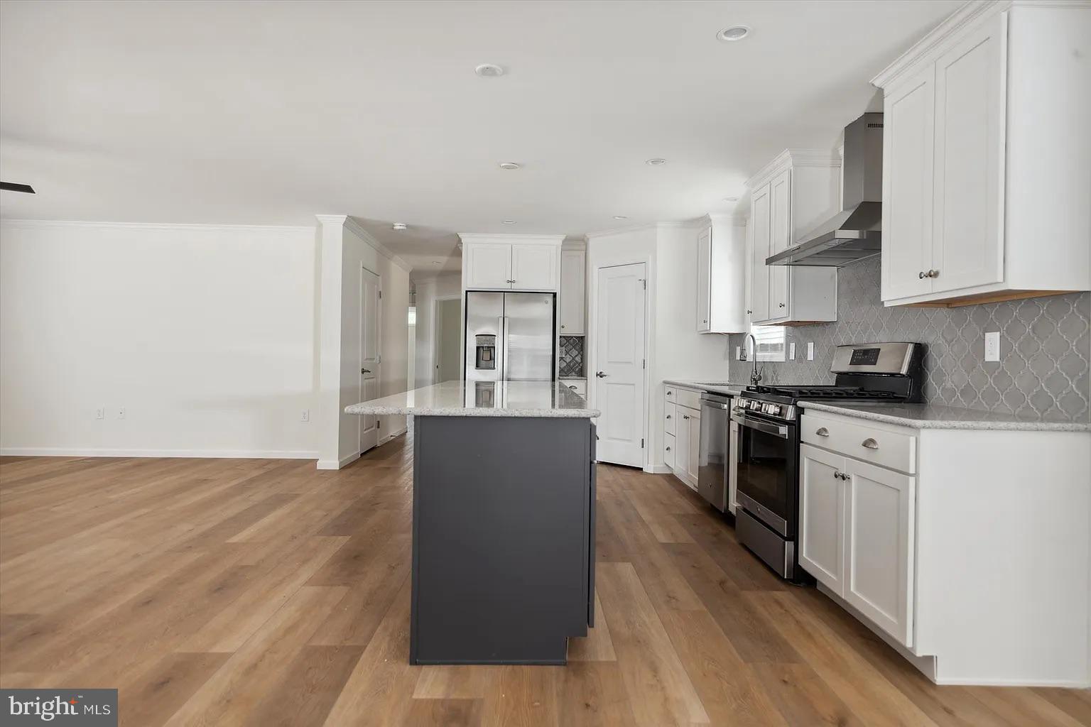 2 Ginger Lane Conowingo, MD 21918 - Photo 14 of 27 a kitchen with granite countertop a stove top oven a sink dishwasher and a refrigerator with wooden floor