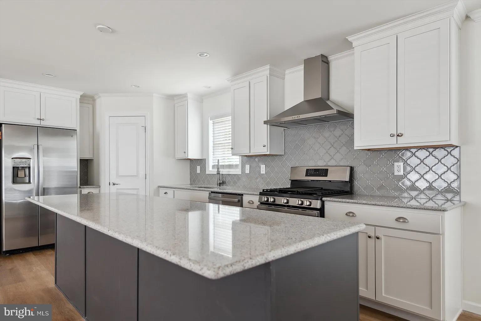 2 Ginger Lane Conowingo, MD 21918 - Photo 15 of 27 a kitchen with stainless steel appliances a sink a stove a refrigerator a center island and cabinets