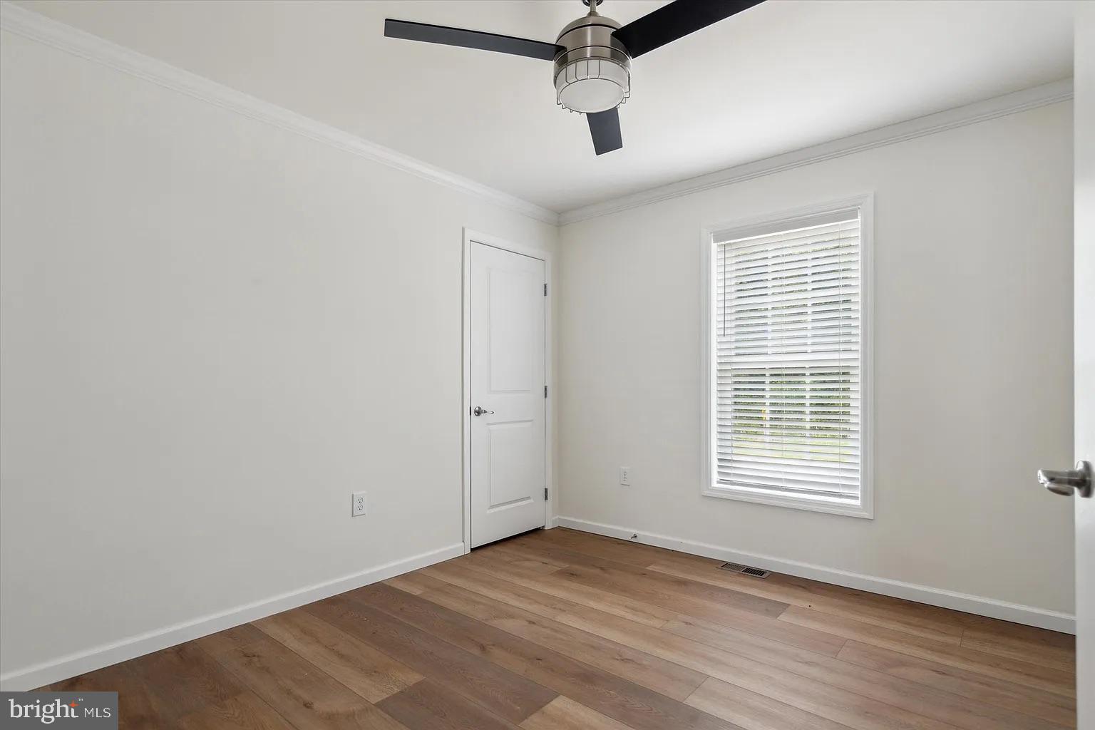 2 Ginger Lane Conowingo, MD 21918 - Photo 16 of 27 a view of an empty room with wooden floor and a window