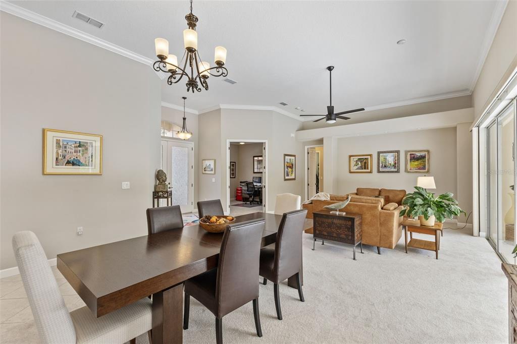 6840 Coyote Ridge Court Bradenton, FL 34201 - Photo 11 of 39 a view of a dining room with furniture window and wooden floor