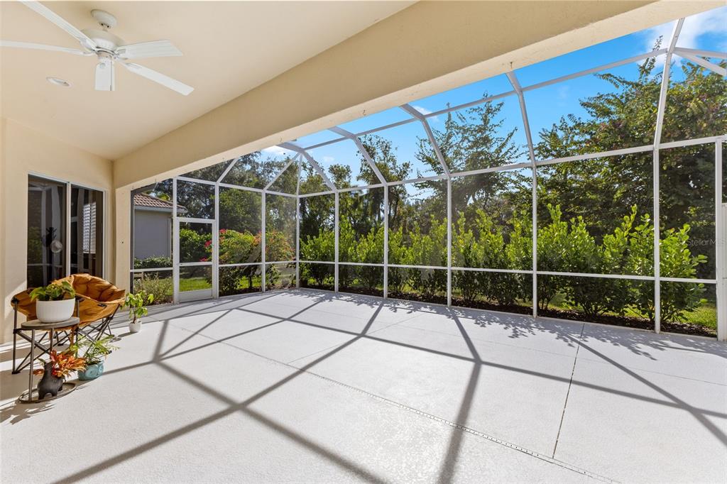 6840 Coyote Ridge Court Bradenton, FL 34201 - Photo 30 of 39 a view of a room with wooden floor and potted plants