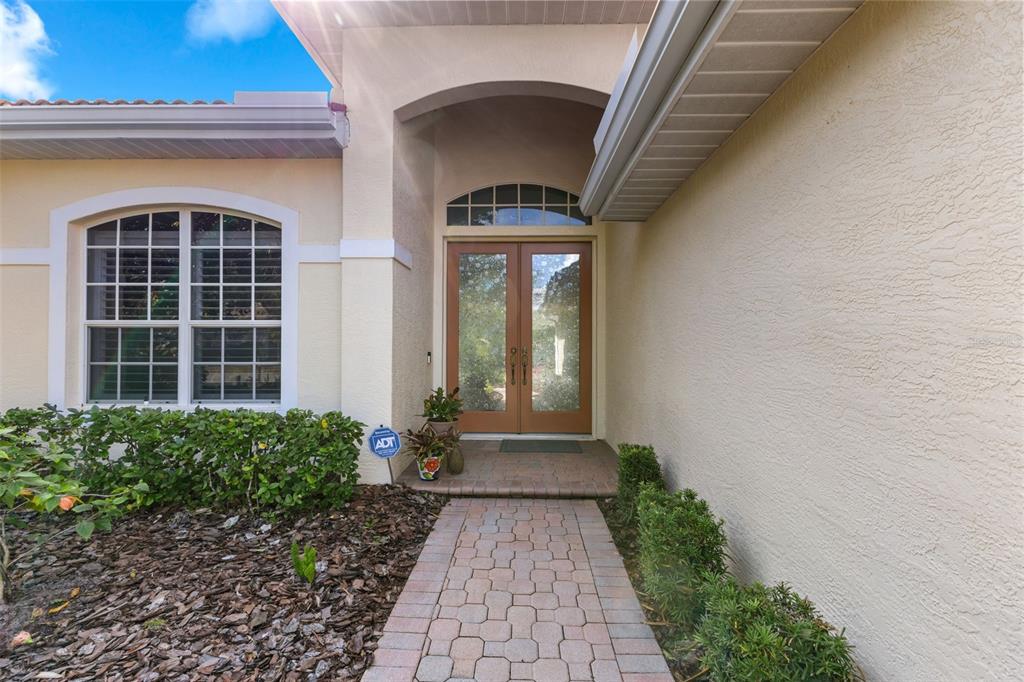 6840 Coyote Ridge Court Bradenton, FL 34201 - Photo 35 of 39 a front view of a house with a yard