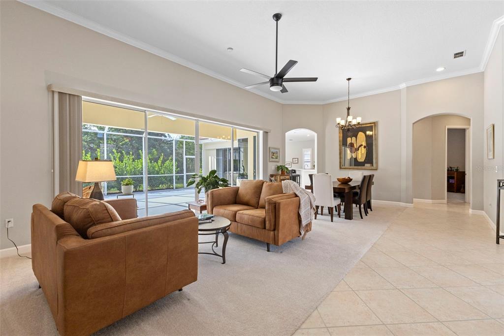 6840 Coyote Ridge Court Bradenton, FL 34201 - Photo 5 of 39 a living room with furniture and a large window